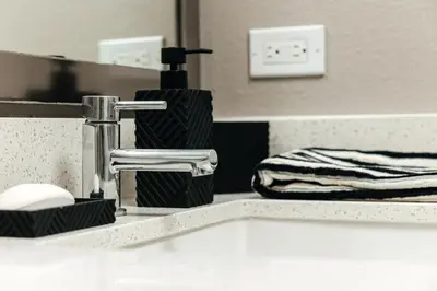 a bathroom counter with a sink and a mirror at West Hollywood Luxe Townhome Walkable WeHo Avalon in Los Angeles