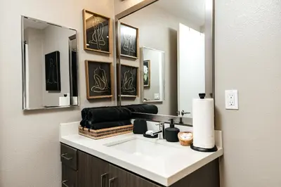 a bathroom with a sink and a mirror at West Hollywood Luxe Townhome Walkable WeHo Avalon in Los Angeles