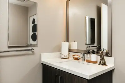 a bathroom with a sink and a mirror at West Hollywood Luxe Townhome Walkable WeHo Avalon in Los Angeles