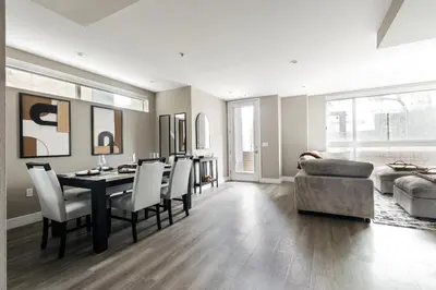 a living room with a table and chairs and a couch at West Hollywood Luxe Townhome Walkable WeHo Avalon in Los Angeles