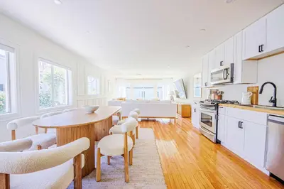 a kitchen with a table and chairs and a dining room at Chic 6BR West Hollywood Villa with Jacuzzi in Los Angeles