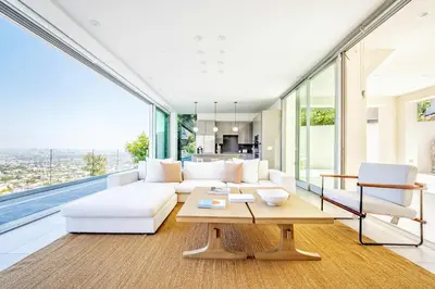 a living room with a white couch and a table at Hillside 4B Villa w Infinity Pool City Views in Los Angeles