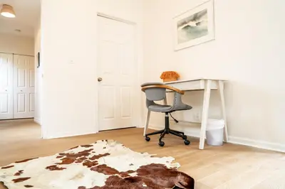 a room with a desk and a chair and a rug at Curated Central Location LA in Los Angeles