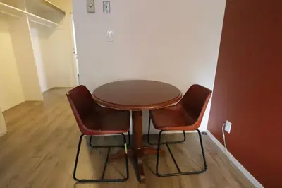 a table and two chairs in a room at Cozy Beverly Hills Hotel Style apartment in Los Angeles