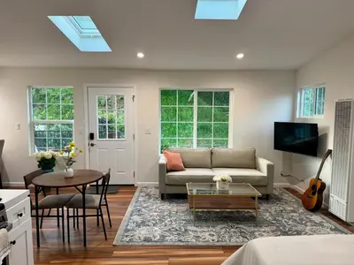 a living room with a couch and a table at Skylight Terrace in Los Angeles