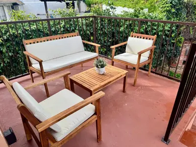 two chairs and a table on a patio at Skylight Terrace in Los Angeles