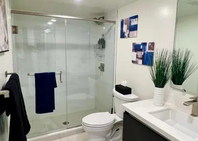 a bathroom with a shower and a toilet and a sink at Cozy Century City 2 Br Sleeps 6 with Parking 505 in Los Angeles
