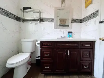 a bathroom with a toilet and a sink at Asian Food Galler Single house in San Gabriel