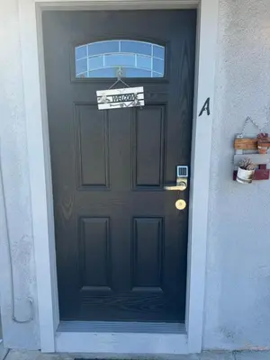 a black door with a sign on it at Asian Food Galler Single house in San Gabriel