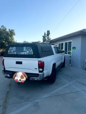 a white truck parked in a parking lot with a stuffed animal at Asian Food Galler Single house in San Gabriel