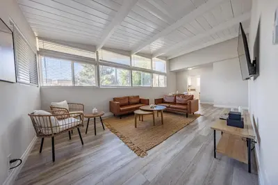 a living room with a couch and a table at Spacious 2-Bedroom Duplex in Beverly Hills Residential Area in Los Angeles