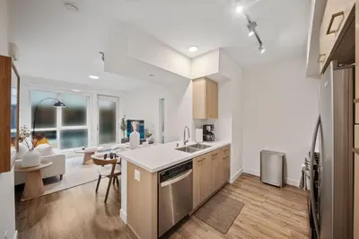 a kitchen with a sink and a counter top at Casa Blanca Coastal Condo Rooftop Heated Pool in Los Angeles