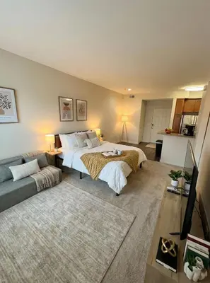 a large bedroom with two beds and a couch at Demo1 in Los Angeles