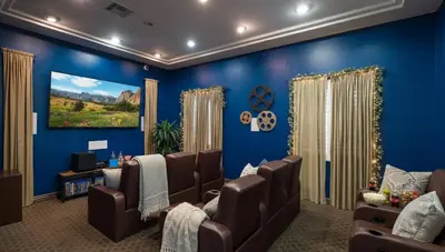 a waiting room with blue walls and brown chairs at Demo1 in Los Angeles