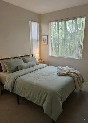 a bedroom with a large bed with a window at Demo1 in Los Angeles