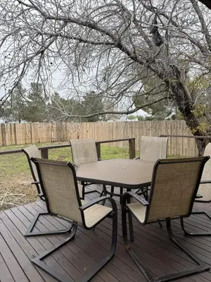 a picnic table and four chairs on a deck at Desert Ranch Retreat in Lancaster