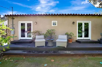 a patio with two chairs and a house at Charming 2BR 2BA Los Angeles Home with Character in Sherman Oaks Community Hospital Heliport