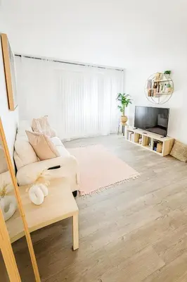 a white living room with a couch and a tv at Hollywood Hills Haven - Resort Living Near Universal Studios & Warner Bros in Los Angeles