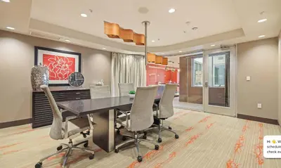 a dining room with a table and chairs at Modern 2BR at the Huxley Prime West Hollywood Location in Los Angeles