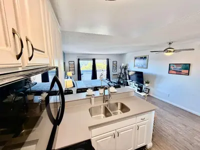 a kitchen with a sink and a counter top at Hollywood Studio with Pool, Parking, Gym & Sign View in Los Angeles