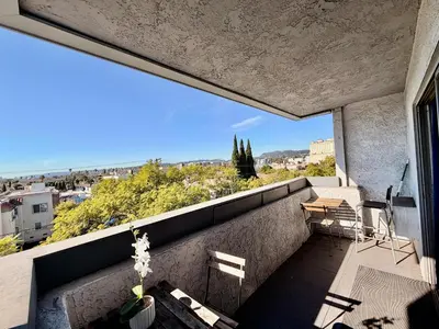 a balcony with a view of a city at Hollywood Studio with Pool, Parking, Gym & Sign View in Los Angeles