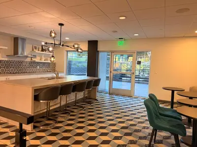 a restaurant with a bar with chairs and tables at Hollywood Studio with Pool, Parking, Gym & Sign View in Los Angeles