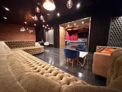 a living room with couches and a couch and a table at Modern & Popular Hollywood Studio at GW in Los Angeles
