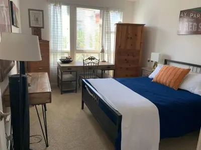 a bedroom with a bed and a desk and a chair at Sweet Beautiful 2 bedrooms home in Los Angeles
