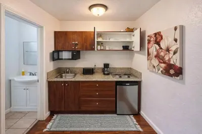a small kitchen with a sink and a dishwasher at Charming Studio in the Heart of Hollywood in Los Angeles