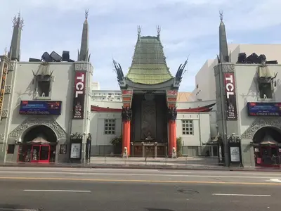 a large white building with a green roof at Compact Hollywood Studio in Los Angeles