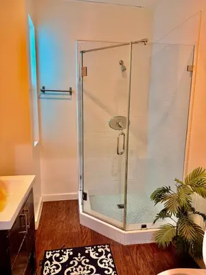 a shower with a glass door in a bathroom at Compact Hollywood Studio in Los Angeles