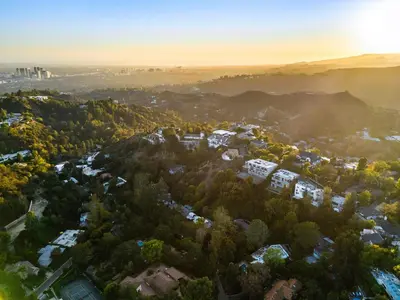 an aerial view of a city with trees at Ultra Luxury 5BR Beverly Hills Estate with Private Pool Spa and Canyon Views in Los Angeles