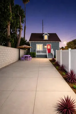 a house with a red door and a white fence at Vernon Homes For The Soul in Los Angeles