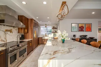 a large kitchen with a large marble counter top at Phenomenal King, Air, Rooftop Deck, Walk to Beach in Hermosa Beach