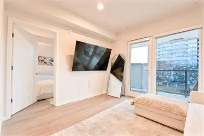 a bedroom with a bed and a large window at Hollywood Palladium 1 BD EV charger Free Parking in Los Angeles