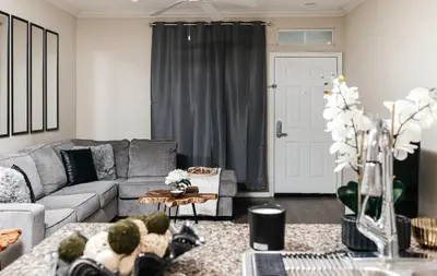 a living room with a couch and a table at Stylish Glendale Retreat by Americana & Galleria in Glendale