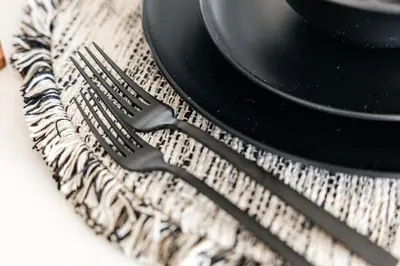 a fork sitting next to a plate on a table at Penthouse Muse, West Hollywood, Los Angeles in Los Angeles