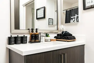 a bathroom counter with a sink with a mirror at Penthouse Muse, West Hollywood, Los Angeles in Los Angeles
