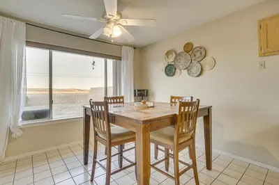 a dining room with a table and chairs and a window at Golf, Fish and More! Peaceful Home in Helendale in Helendale