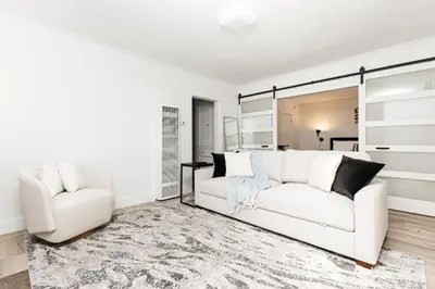 a living room with a white couch and a chair at Peaceful 2BD Home in WeHo in Los Angeles