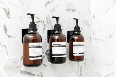 a group of three bottles of soap on a counter at Peaceful 2BD Home in WeHo in Los Angeles