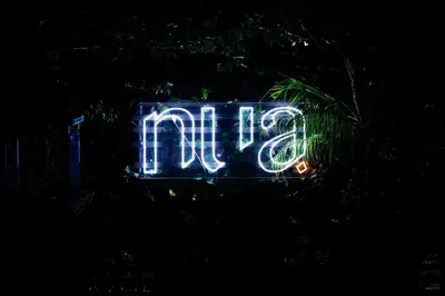 a lit up sign that says frijo at night at The Crescent Hotel Beverly Hills in Los Angeles