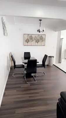 a dining room with a table and chairs at Modern2BR Home SoFi LAX Parking Fast WiFi in Los Angeles
