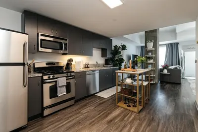 a kitchen with a stove and a refrigerator at City Sanctuary - Urban Hideaway in Los Angeles
