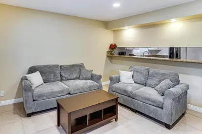 a living room with two couches and a coffee table at 5 Mi to Anaheim Convention Center Retreat with Yard in Anaheim