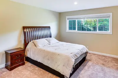 a bedroom with a bed and a window at 5 Mi to Anaheim Convention Center Retreat with Yard in Anaheim