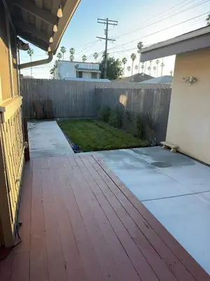 a patio with a fence and a yard at Family gateway in the heart of Los Angeles 2bedroom 2bath backyard in Los Angeles