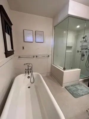 a white bath tub in a bathroom with a shower at Family gateway in the heart of Los Angeles 2bedroom 2bath backyard in Los Angeles