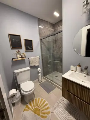a bathroom with a shower and a toilet and a sink at Family gateway in the heart of Los Angeles 2bedroom 2bath backyard in Los Angeles