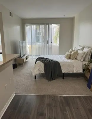 a bedroom with a bed and a large window at Marina Del Rey Heavenly Stay in Los Angeles